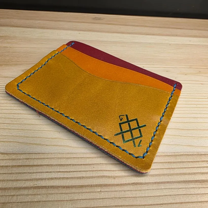 Rainbow Wave cardholder interior with a green maker's mark